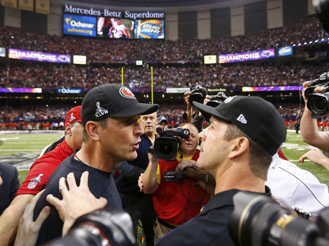 49ers head coach Jim Harbaugh congratulates his brother and Ravens head coach John Harbaugh after the Ravens defeated the 49ers to win the NFL Super Bowl XLVII football game in New Orleans (Credit: Reuters/Jeff Haynes)