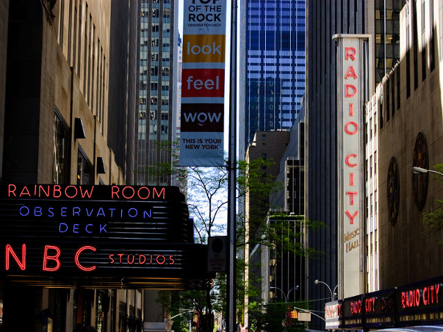 A view down 49th Street in New York City, Rockefeller Center, home to NBC Studios and Saturday Night Live, The Rainbow Room and Radio City Music Hall (Credit: Kirill Levin via Flickr)