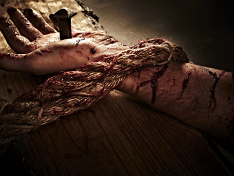 A close-up representation of Jesus' left hand nailed to the cross (Credit: Pearl via Lightstock)