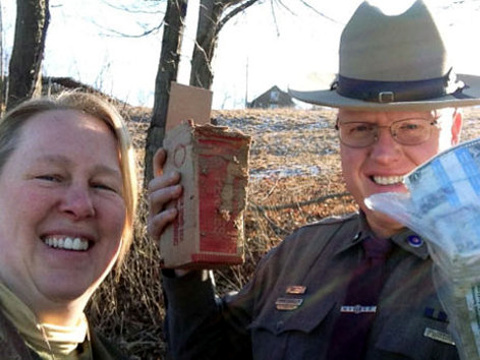 Patty Wesner of Greenwich, the good samaritan who found and returned money that fell from a Brinks truck traveling in front of her poses with New York State trooper Kevin Saunders, who responded to Wesner's 911 call (Photo Courtesy: Patty Wesner)