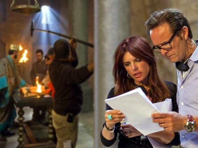 Roma Downey and Mark Burnett, executive producers of The Bible miniseries on The History Channel go over changes on the set (Credit: Lightworkers Media/Joe Alblas)