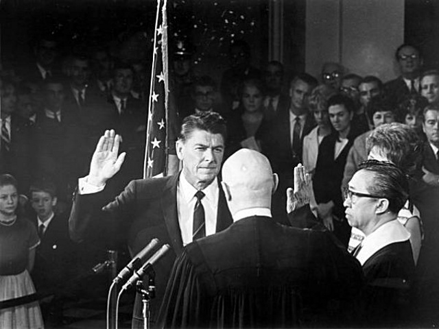 Republican Ronald Reagan is sworn in as governor of California as he takes the oath of office from California State Justice Marshall F. McCombs in Sacramento, California, January 2, 1967 (Credit: AP)