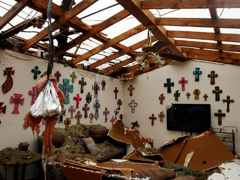 The living room of a home that had its roof blown off by a tornado is pictured in Cleburne, Texas May 16, 2013 (Credit: Reuters/Richard Rodriguez)