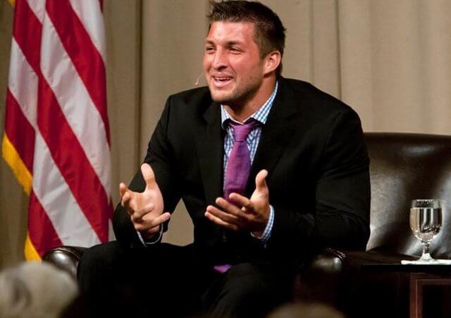 Quarterback Tim Tebow speaks to the Economic Club of Southwest Michigan on Thursday, May 9, 2013, at the Mendel Center at Lake Michigan College near Benton Harbor, Michigan. (Credit: James Brosher/South Bend Tribune)