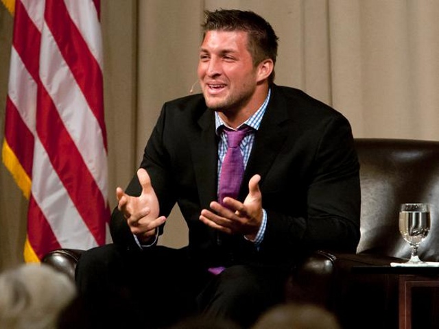 Quarterback Tim Tebow speaks to the Economic Club of Southwest Michigan on Thursday, May 9, 2013, at the Mendel Center at Lake Michigan College near Benton Harbor, Michigan. (Credit: James Brosher/South Bend Tribune)