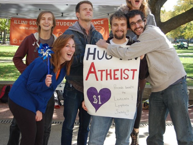 Students from the Illini Secular Student Alliance have some fun at their Hug an Atheist fundraiser for the Leukemia Lymphoma Society, October 10, 2012 (Credit: Illini Secular Student Alliance via Facebook)