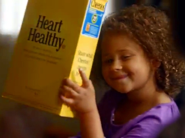 screen grab from a Cheerios commercial that is part of their Just Checking campaign. The commercial has created a controversy because of its depiction of an interracial family (Credit: Cheerios)
