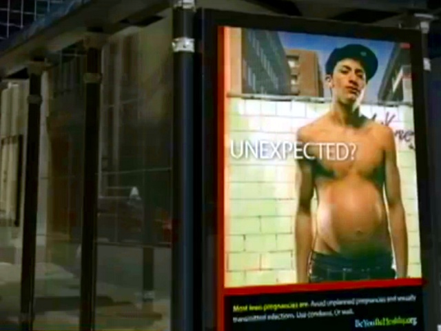A shocking new ad from the Chicago Department of Public Health featuring a boy that appears pregnant, seen here at a bus stop (Credit: Chicago Department of Public Health/ABC)