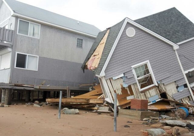 People view one of many homes badly damaged by Hurricane Sandy is pictured in the Cosey Beach neighbourhood of East Haven, Connecticut, October 30, 2012 (Credit: Reuters/Michelle McLoughlin)