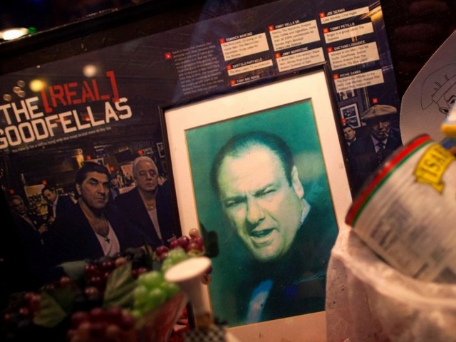A photo of James Gandolfini is displayed in the window of a restaurant in Little Italy, New York in tribute to the actor (Credit: Reuters/Eric Thayer)