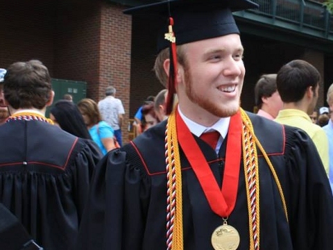 Roy B Costner IV, valedictorian of Liberty High School in Pickens County, South Carolina, who ripped up his original speech and delivered another thanks his parents for bringing him to Christ and reciting the Lord's prayer, stands outside Clemson's Littlejohn colesium following his graduation ceremony (Credit: Angie Costner via Facebook)