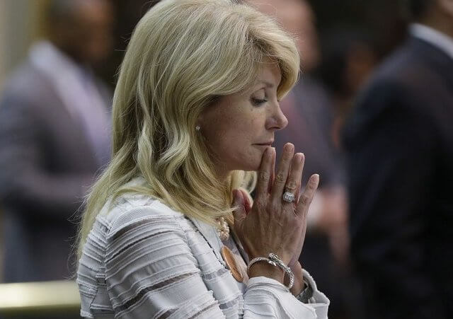 Texas State Senator Wendy Davis, D-Fort Worth, reacts after she was called for a third and final violation in rules to end her filibuster attempt to kill an abortion bill, Tuesday, June 25, 2013, in Austin, Texas (Credit: AP/Eric Gay)
