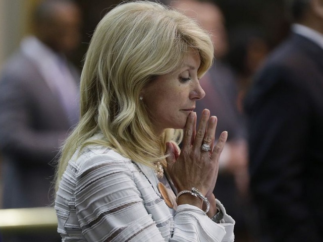 Texas State Senator Wendy Davis, D-Fort Worth, reacts after she was called for a third and final violation in rules to end her filibuster attempt to kill an abortion bill, Tuesday, June 25, 2013, in Austin, Texas (Credit: AP/Eric Gay)