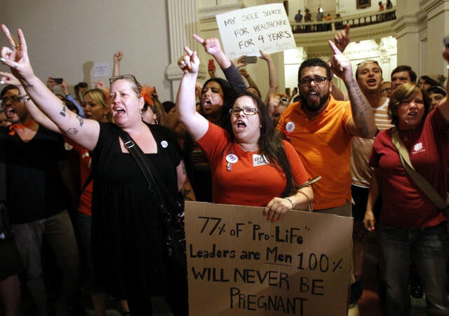 Abortion rights activists demonstrate outside the floor of the House after the HB2 bill restricting abortion rights passed in Austin, Texas July 9, 2013 (Credit: Reuters/Mike Stone)
