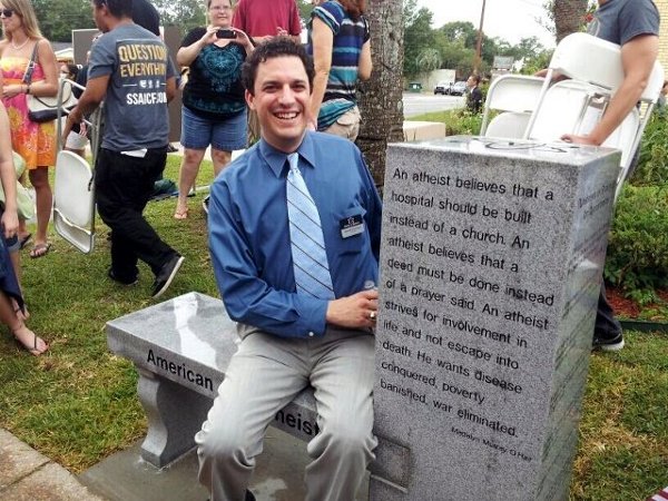 David Silverman, president of American Atheists, seated at a monument bench unveiled and dedicated on June 29, 2013 at the Free Speech Forum at the Bradford County Courthouse, Florida (Credit: American Atheists via Facebook)