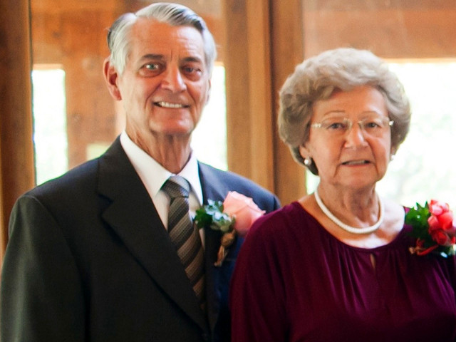 Wayne Croswhite and his wife Lorraine, parents of Janet Denison, pose for a photo at their grandson's wedding at Possum Kingdom Lake (Credit: Taylor Lord Photography)