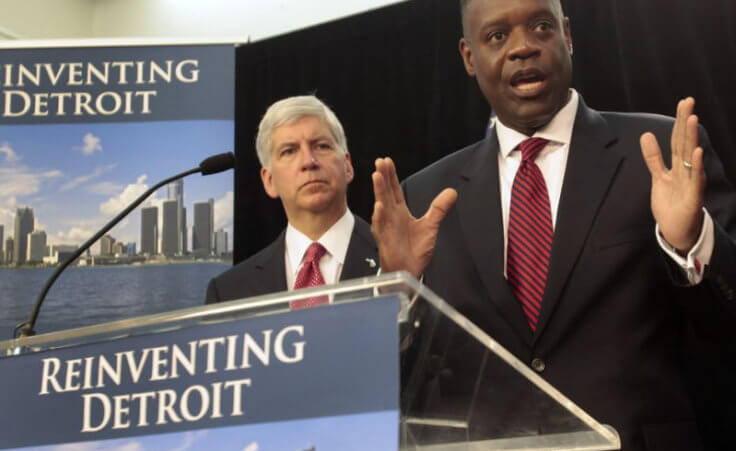 Detroit Emergency Manager Kevyn Orr addresses the media as Michigan Governor Rick Snyder listens during a news conference about filing bankruptcy for the city of Detroit (Credit: Reuters/Rebecca Cook)