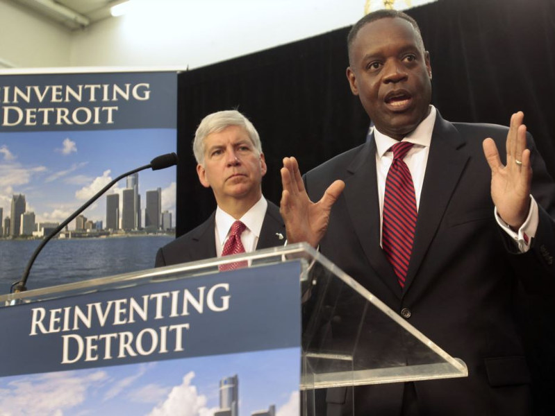 Detroit Emergency Manager Kevyn Orr addresses the media as Michigan Governor Rick Snyder listens during a news conference about filing bankruptcy for the city of Detroit (Credit: Reuters/Rebecca Cook)
