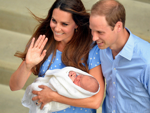Britain's Catherine, Duchess of Cambridge, holds her baby son outside the Lindo Wing of St Mary's Hospital before leaving with Prince William, in central London July 23, 2013 (Credit: Reuters/John Stillwell)