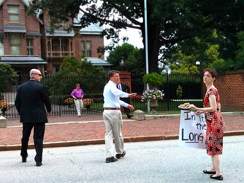North Carolina Governor McCrory gives a plate of cookies to pro-choice activists outside the governor's mansion (Credit: Irene Godinez via Twitter)