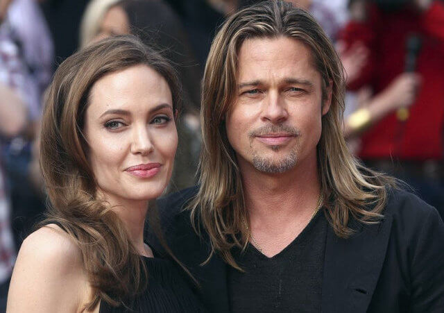 Angelina Jolie and her partner Brad Pitt arrive for the world premiere of his film 'World War Z'
