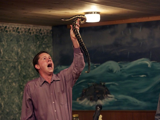 Andrew Hamblin preaches while holding snake above head (Credit: NGT via National Geographic)