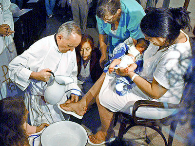 Archbishop of Buenos Aires, Cardinal Jorge Mario Bergoglio washing the feet of a unidentified woman on Holy Thursday at the Buenos Aires' Sarda maternity hospital on March 24, 2005 (Credit: Reuters/Tony Gomez-Dyn)