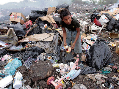 A boy scavenged through garbage at a landfill in Rio Hato, Panama, Wednesday. Human-rights organizations say extreme poverty remains an unresolved issue in the country (Credit: Reuters/Alberto Lowe)