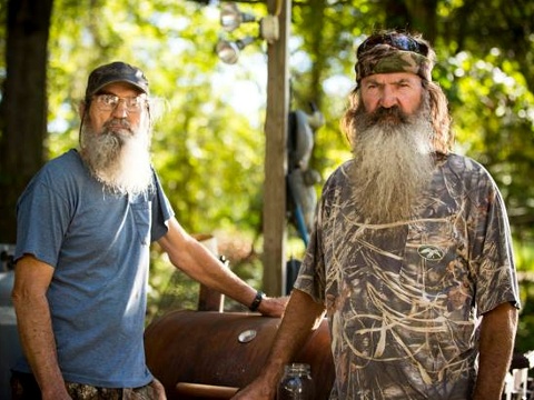 Duck Dynasty stars Phil and Si Robertson grilling some dinner (Credit: A&ETV/Duck Dynasty via Facebook)