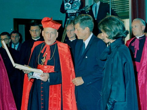 Archbishop of Boston, Massachusetts, Richard Cardinal Cushing (L), addresses visitors during visit by President John F. Kennedy (C) and Jacqueline Kennedy (R) to the Pontifical North American College (also known as American College of the Roman Catholic Church of the United States) in Rome, Italy (Credit: White House/The John F. Kennedy Presidential Library and Museum/Cecil W Stoughton)