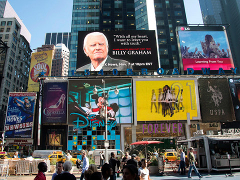 In the middle of one of the busiest places on earth, a giant billboard features a quote from Billy Graham, urging people to tune in Nov. 7 to hear the Gospel message. Just weeks before his 95th birthday, Mr. Graham is telling the nation, 'With all my heart, I want to leave you with truth' (Credit: BGEA/Kristy Etheridge)