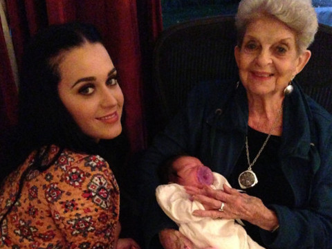 Katy Perry celebrates Thanksgiving with family and tweets this photo of her and her grandmother holding Katy's new baby niece (Credit: Katy Perry via Twitter)