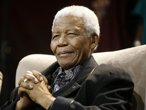 Nelson Mandela listens to the State of The Nation address being delivered by the current President Jacob Zuma at Parliament in Cape Town, June 3, 2009 (Credit: Reuters/Mike Hutchings)