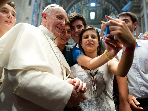 Pope Francis has his picture taken inside St. Peter’s Basilica with youths from the Italian Diocese of Piacenza and Bobbio who came to Rome for a pilgrimage, August 28, 2013 (L'Osservatore Romano via AP)