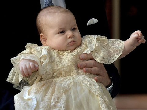 Britain's Prince William carries his son Prince George as they arrive for his son's christening at Saint James's Palace in London on Oct 23, 2013 (Credit: Reuters/John Stillwell)