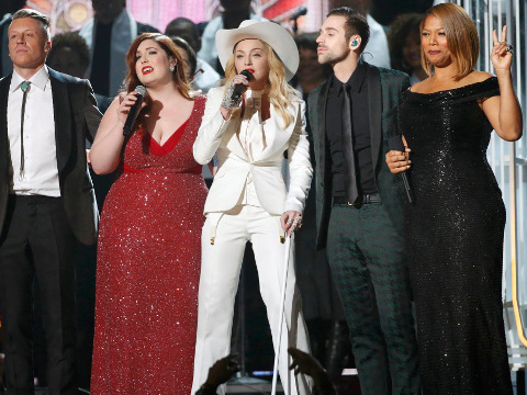 Macklemore, Mary Lambert, Madonna, Ryan Lewis and Queen Latifah (L-R) perform 'Same Love' at the 56th Annual Grammy Awards held on January 26, 2014, at the Staples Center in Los Angeles (Credit: Reuters/Mario Anzuoni)