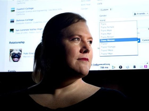 Facebook software engineer Brielle Harrison demonstrates expanded options for gender identification at her company's Menlo Park, Calif., headquarters, Wednesday, Feb. 12, 2014 (Credit: AP/Noah Berger)