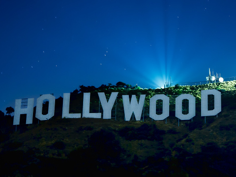 The Hollywood Sign is a famous landmark in the Hollywood Hills area of Mount Lee in Los Angeles, California, spelling out the name of the area in 50-foot (15 m) tall white letters (Credit: Bobby Gibbons via Flickr)