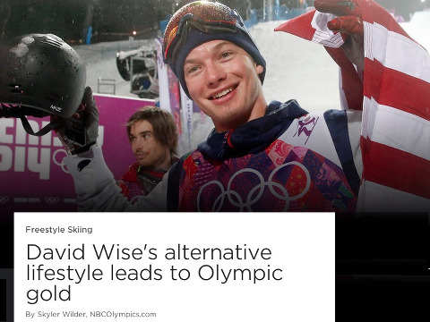 David Wise, US freestyle skier, holds up the American flag after his gold medal run in the freestyle skiing halfpipe event at the 2014 Sochi Winter Olympic Games in Rosa Khutor, February 18, 2014 (Credit: NBCOlympics.com)