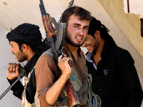 Free Syrian Army fighters in Raqqa, in north-central Syria, on Friday. In mid-August, extremists from ISIS drove an FSA unit from the city (Credit: Reuters)