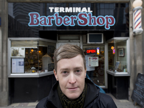 Faith McGregor, stands outside Toronto's Terminal Barbershop on Bay Street where she was refused a haircut after the barber said it is against his religion to touch a woman outside of his family (Credit: National Post/Peter J. Thompson)