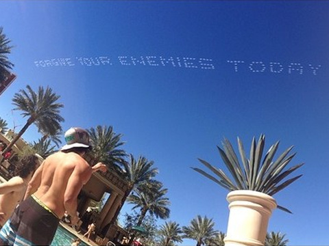 FORGIVE YOUR ENEMIES TODAY, a skytyped message as seen by guests by the Azure Luxury Pool at The Palazzo Hotel, and many others along the Las Vegas strip (Credit: Daniel Wanderman via Instagram)