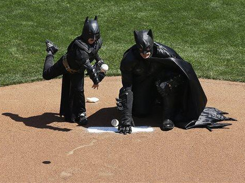 The BatKid, Miles Scott, a five year-old leukemia survivor, throws out the first pitch at the San Francisco Giants' opening day game (Credit: Kari Van Horn via Twitter)