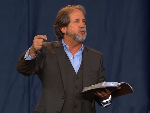 Bob Coy, founder and pastor of Calvary Chapel in Fort Lauderdale, Florida, addresses the student body of Liberty University at Convocation, the largest weekly gathering of Christian students in North America, November 15, 2013 (Credit: Liberty University via YouTube)