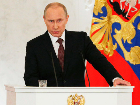 Russian President Vladimir Putin addresses the Federal Assembly, including State Duma deputies, members of the Federation Council, regional governors and civil society representatives, at the Kremlin in Moscow March 18, 2014 (Credit: Reuters/Maxim Shemetov)