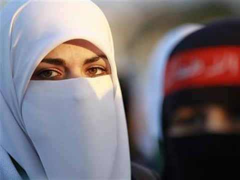 Syrian women living in Jordan take part in a demonstration against Syrian President Bashar Al-Assad in front of the Syrian embassy in Amman February 2, 2012 (Credit: Reuters/Muhammad Hamed)