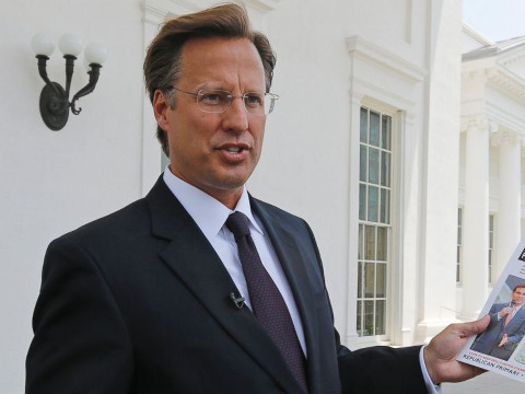 Seventh District US Congressional Republican candidate, David Brat displays an immigration mailer by Congressman Eric Cantor during a press conference at the Capitol in Richmond, Va., in this May 28, 2014 (Credit: AP/Steve Helber)