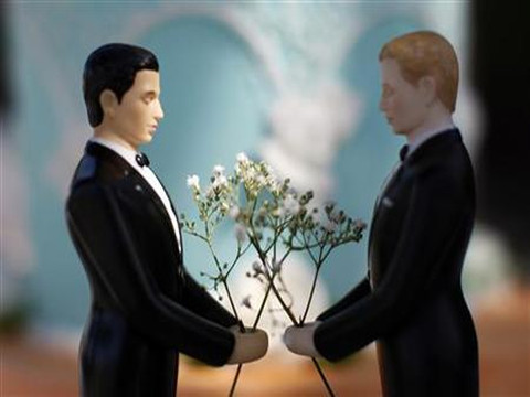 A same-sex wedding cake topper is seen outside the East Los Angeles County Recorder's Office on Valentine's Day during a news event for National Freedom to Marry Week in Los Angeles, February 14, 2012 (Credit: Reuters/David McNew)