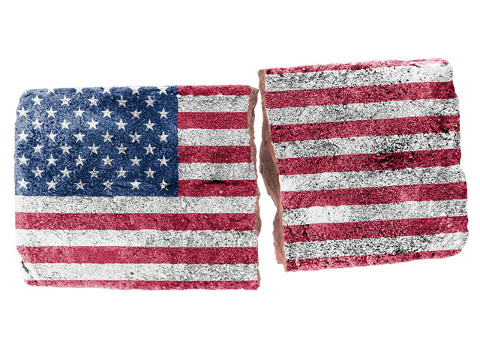 America Divided concept: American flag painted on a broken brick (Credit: michaklootwijk via Fotolia)