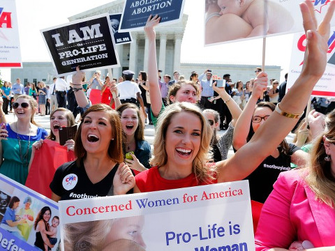 Pro-life supporters with Concerned Women for America celebrate the Hobby Lobby victory at the Supreme Court in Washington on June 30, 2014 (Credit: Reuters/Jonathan Ernst)